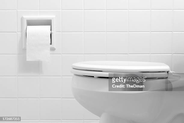clean, white bathroom toilet with the lid closed - monochrome bathroom stock pictures, royalty-free photos & images