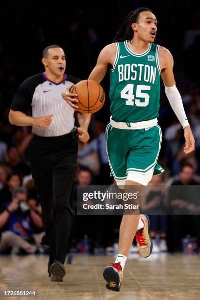 Dalano Banton of the Boston Celtics dribbles during the first half of a preseason game against the New York Knicks at Madison Square Garden on...