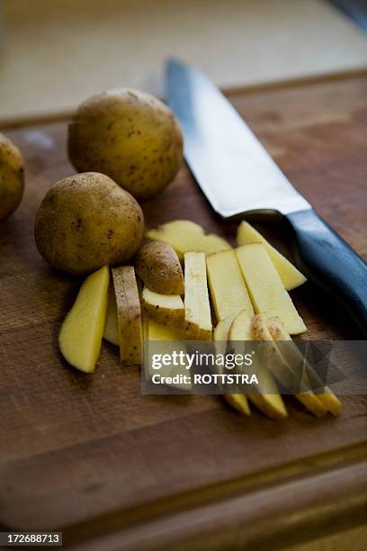turning potatoes into french fries using knife - cutter stock pictures, royalty-free photos & images