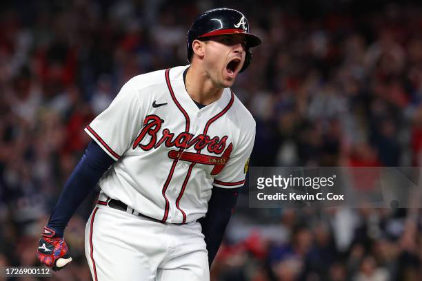 Austin Riley of the Atlanta Braves rounds the bases after hitting a two-run home run in the eighth inning against the Philadelphia Phillies during...