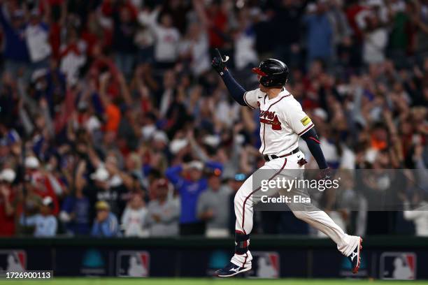 Austin Riley of the Atlanta Braves rounds the bases after hitting a two-run home run in the eighth inning against the Philadelphia Phillies during...