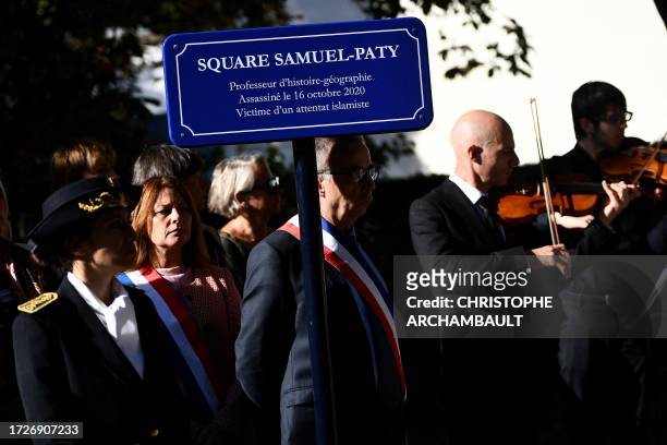 Bordeaux mayor Pierre Hurmic stands in respect beside a commemorative plaque during the inauguration of a square called after the name of slain...
