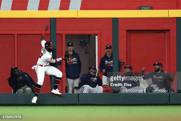 Michael Harris II of the Atlanta Braves makes a catch at the wall in the ninth inning against the Philadelphia Phillies during Game Two of the...