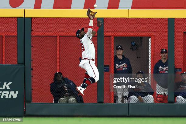 Michael Harris II of the Atlanta Braves makes a catch at the wall in the ninth inning against the Philadelphia Phillies during Game Two of the...