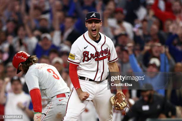 Matt Olson of the Atlanta Braves reacts to a double play that ended the game against the Philadelphia Phillies to win Game Two of the Division Series...