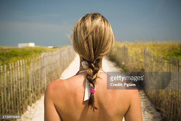 woman on her way to the beach. - human hair strand stock pictures, royalty-free photos & images