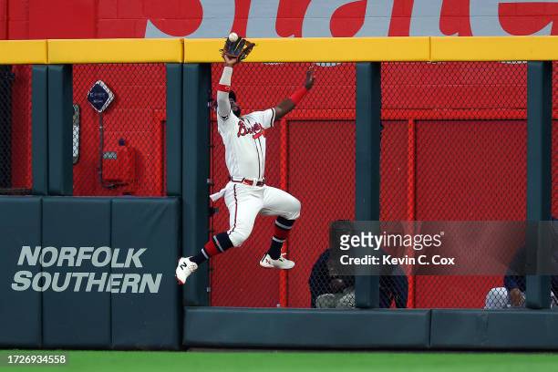 Michael Harris II of the Atlanta Braves makes a catch at the wall in the ninth inning against the Philadelphia Phillies during Game Two of the...