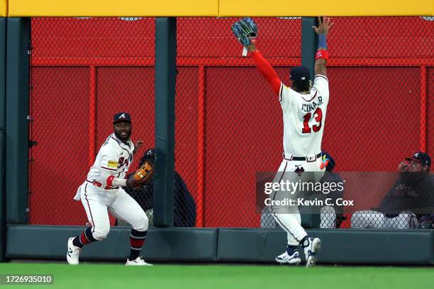 Michael Harris II of the Atlanta Braves makes a catch at the wall in the ninth inning against the Philadelphia Phillies during Game Two of the...