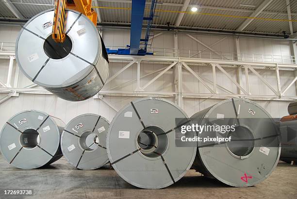 crane with rolls of sheet steel - stainless steel stock pictures, royalty-free photos & images