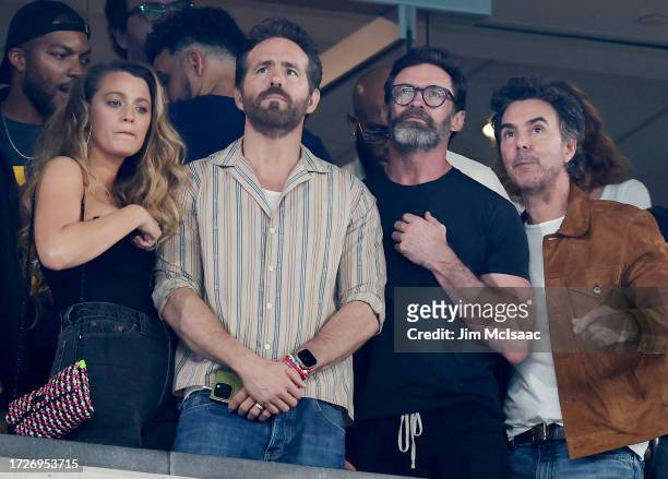 Actress Blake Lively and actors Ryan Reynolds and Hugh Jackman attend a game between the New York Jets and the Kansas City Chiefs at MetLife Stadium...