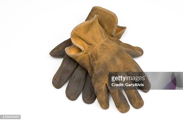 old well worn leather work gloves-isolated on white - leather gloves stock pictures, royalty-free photos & images