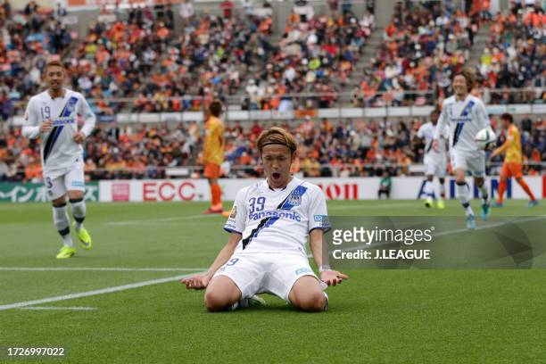 Takashi Usami of Gamba Osaka celebrates after scoring his team's third goal during the J.League J1 first stage match between Shimizu S-Pulse and...