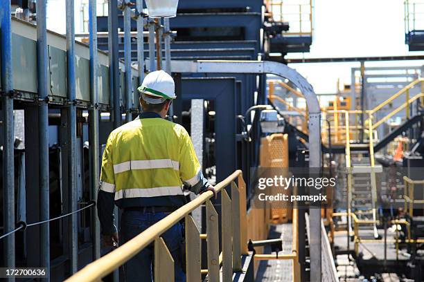 construction worker walking away - mining stock pictures, royalty-free photos & images