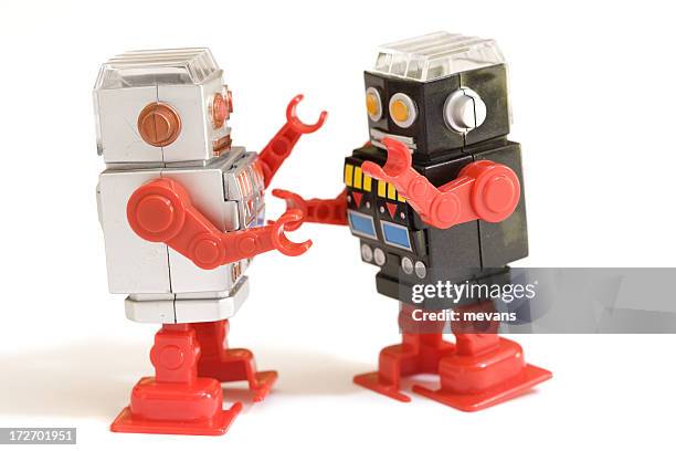 two play robots on white background - kitsch stockfoto's en -beelden