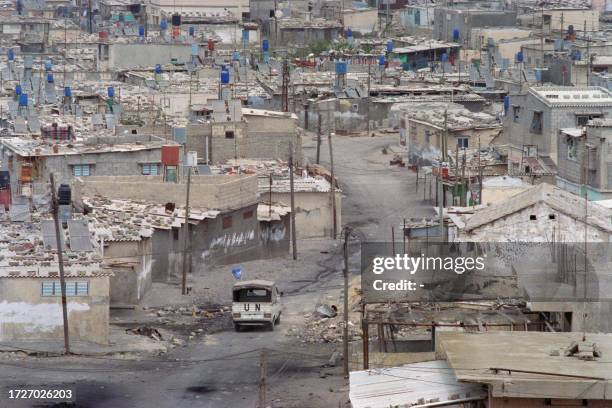 Photo taken on April 13, 1988 shows a UN vehicle driving into the Shati camp, a Palestinian refugee camp located in the northern Gaza Strip, the...