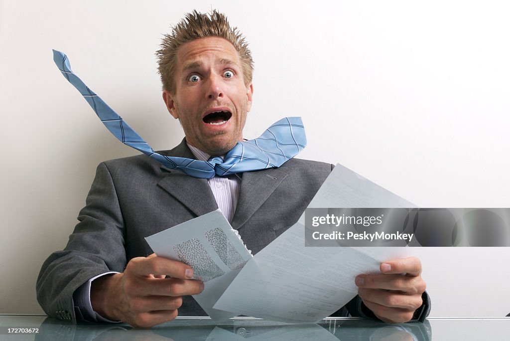 Office Worker Businessman Opening Letter with Expression of Stress
