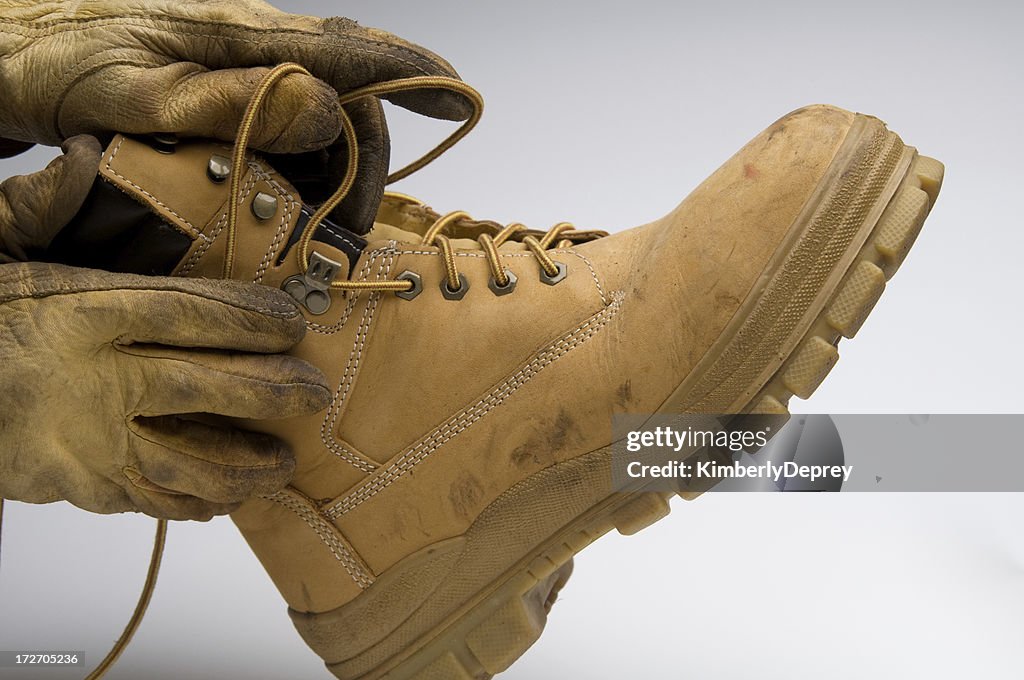 Putting on a work boot