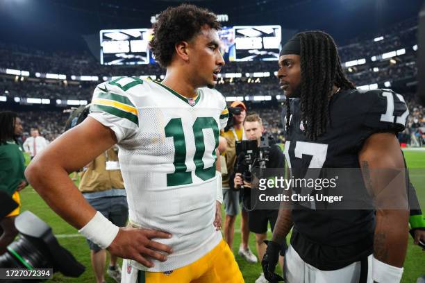 Jordan Love of the Green Bay Packers talks with Davante Adams of the Las Vegas Raiders following the game at Allegiant Stadium on October 09, 2023 in...