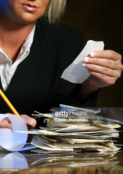 financial budgeting and taxes - stack of receipts stock pictures, royalty-free photos & images