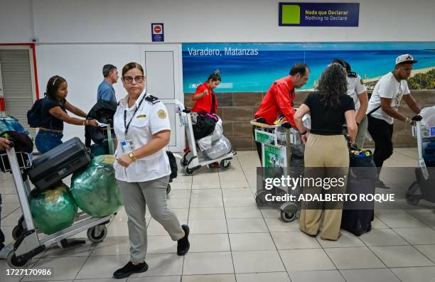 Customs officer checks a passenger's luggage at Havana's Jose Marti airport on October 12, 2023.