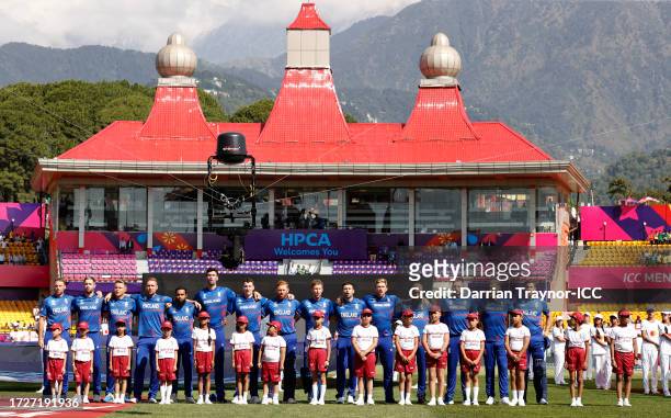 Players of England line up for the National Anthems ahead of the ICC Men's Cricket World Cup India 2023 between England and Bangladesh at HPCA...
