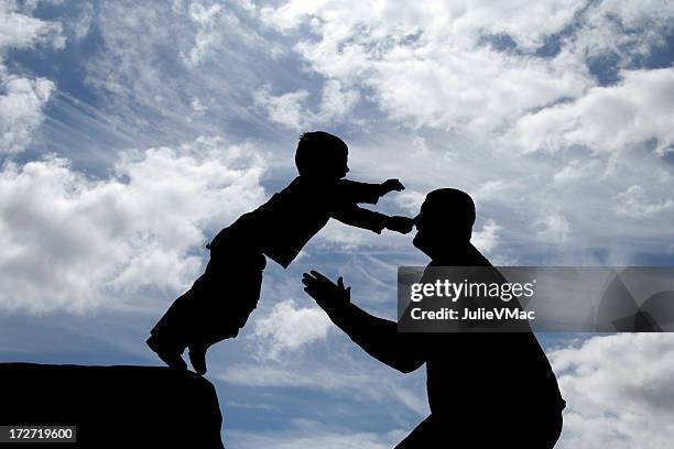 father and son ii - catching stock pictures, royalty-free photos & images