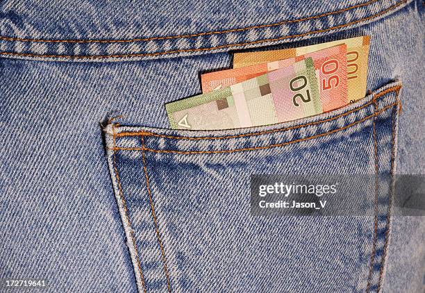 canadian money in a pocket - canadian dollars stock pictures, royalty-free photos & images