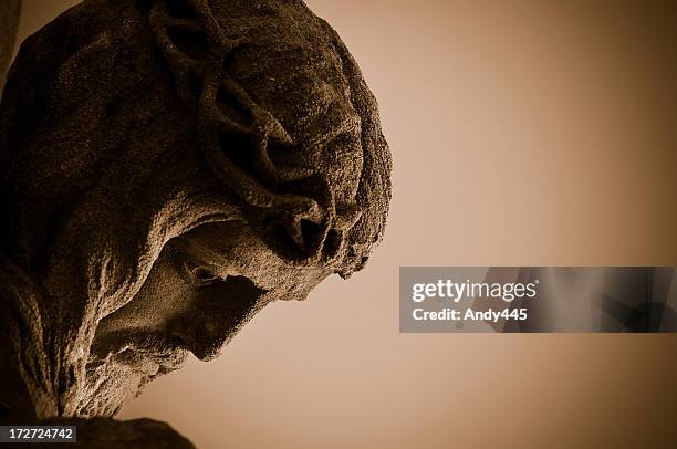 statue of jesus looking down with a shadow - god stock pictures, royalty-free photos & images