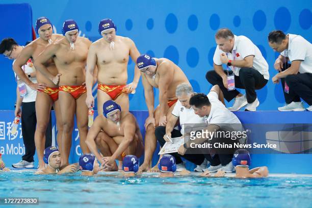 Head coach Petar Porobic of Team China speaks to his players in the Water Polo - Men's Final match against Team Japan on day 14 of the 19th Asian...