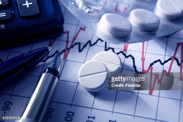 finance: painkillers on stock chart - drug bust stock pictures, royalty-free photos & images