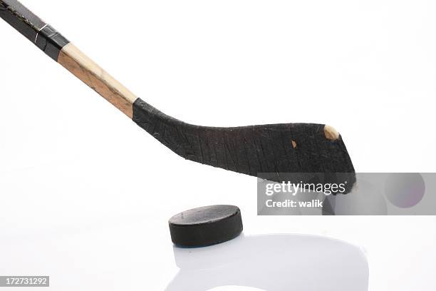 hockey stick - puck stock-fotos und bilder