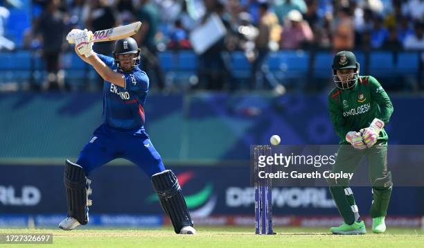 Dawid Malan of England plays a shot as Mushfiqur Rahim of Bangladesh keeps during the ICC Men's Cricket World Cup India 2023 between England and...