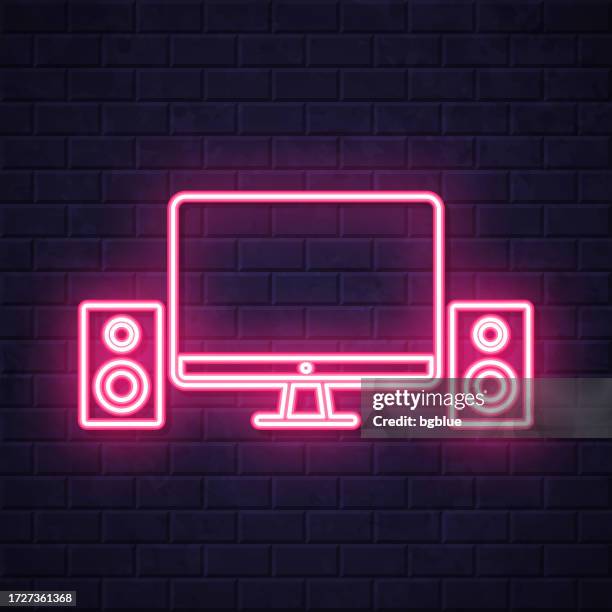 desktop computer with speakers. glowing neon icon on brick wall background - recording studio wall stock illustrations