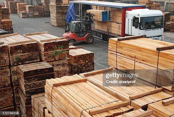 forklift loading boards in a lumberyard - timber stock pictures, royalty-free photos & images