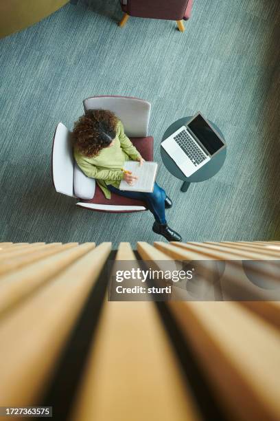 mature student in library - poly stock pictures, royalty-free photos & images