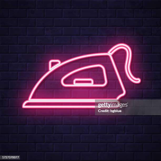 iron. glowing neon icon on brick wall background - iron stock illustrations