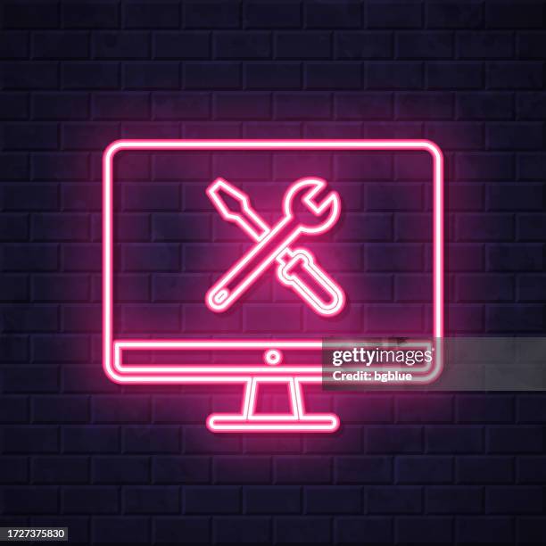 desktop computer settings - tools. glowing neon icon on brick wall background - wall panel stock illustrations