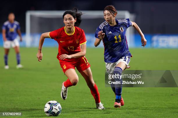 Nakashima Yoshino of Japan competes for the ball with Yang Lina of China during the 19th Asian Games Women's Semifinal match between China and Japan...