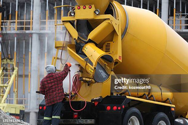 washing a cement truck - cement truck stock pictures, royalty-free photos & images
