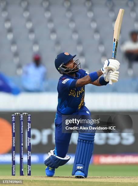 Kusal Mendis of Sri Lanka hits a four during the ICC Men's Cricket World Cup India 2023 between Pakistan and Sri Lanka at Rajiv Gandhi International...