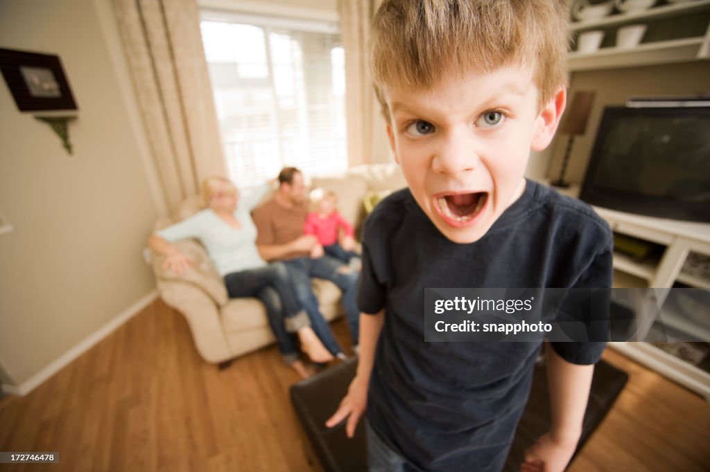 Spoiled child screaming at living room