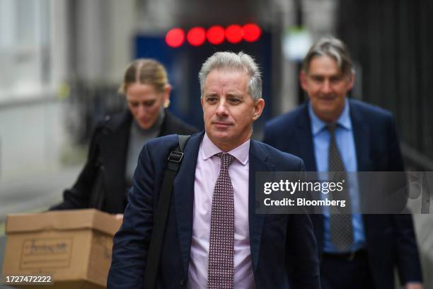 Christopher Steele, ex-MI6 agent, centre, departs from the Royal Courts of Justice in London, UK, on Monday, Oct. 16, 2023. Former US President...