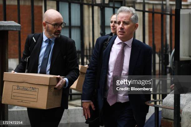 Christopher Steele, ex-MI6 agent, right, departs from the Royal Courts of Justice in London, UK, on Monday, Oct. 16, 2023. Former US President Donald...