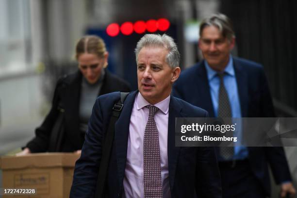 Christopher Steele, ex-MI6 agent, centre, departs from the Royal Courts of Justice in London, UK, on Monday, Oct. 16, 2023. Former US President...