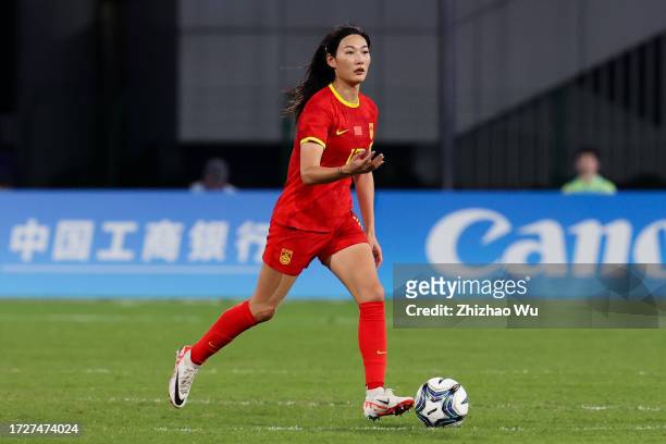 Yang Lina of China controls the ball during the 19th Asian Games Women's Semifinal match between China and Japan at Linping Sports Centre Stadium on...