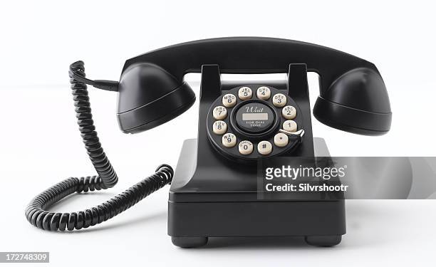 black telephone on white background - old book white background stock pictures, royalty-free photos & images