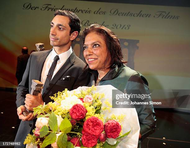 Award winners British actor with Pakistan origins Riz Ahmed and Indian director Mira Nair pose with the award trophy after the Bernhard Wicki Award...