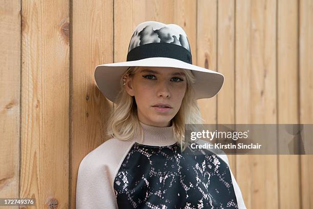 Model Elena Perminova wears a Louis Vuitton top and a Maison Michel hat on day 4 of Paris Collections: Womens Haute Couture on July 04, 2013 in...