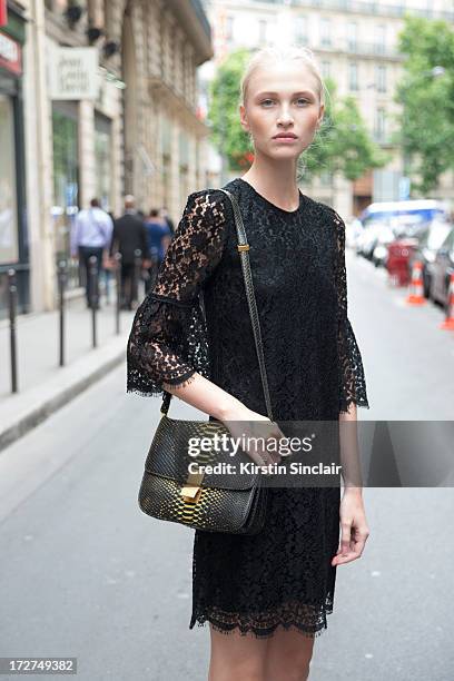 Model Yulia Lobova wears a Dolce and Gabbana dress, Celine bag on day 4 of Paris Collections: Womens Haute Couture on July 04, 2013 in Paris, France.