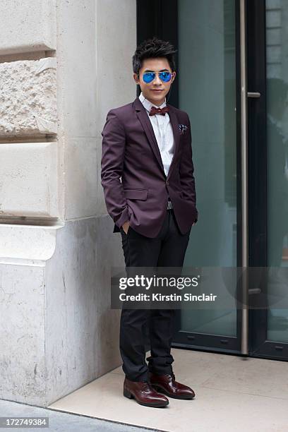 Make up artist Ma Rui wears JDV jacket and shirt, Ray Ban sunglasses and Trousers and shoes from a boutique in China on day 4 of Paris Collections:...